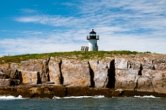 Pond Island Light Over Rocky Cliffs in Maine